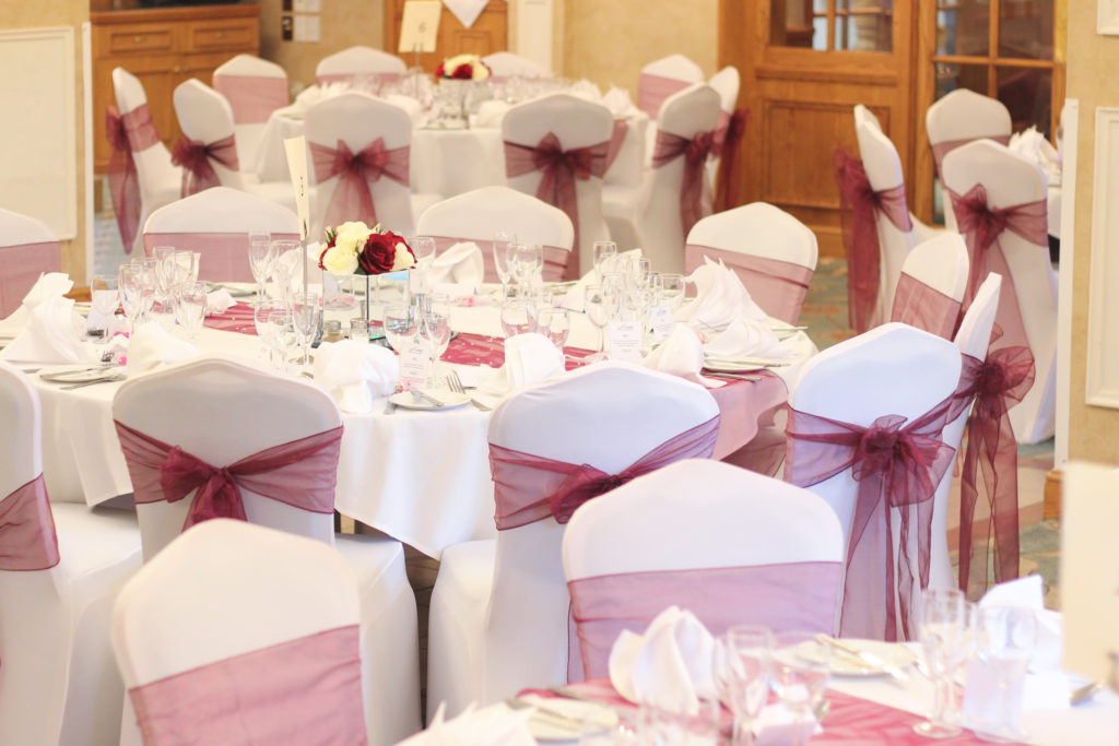 Chair Covers with Red Sashes Wedding Decoration