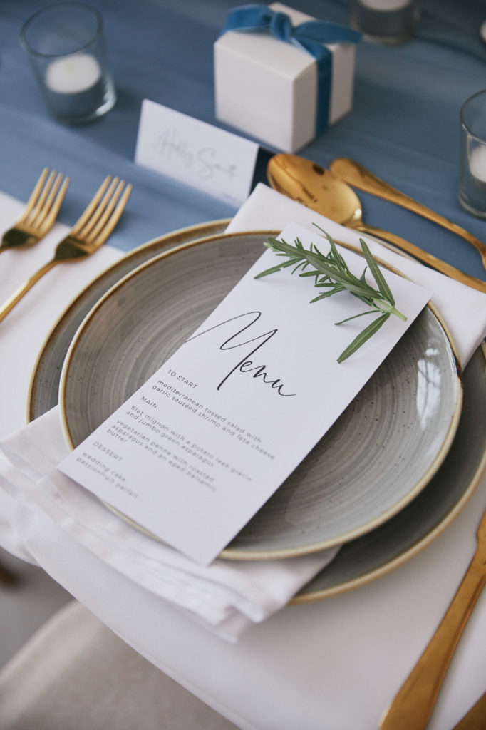 blue wedding table decoration menu card with rosemary
